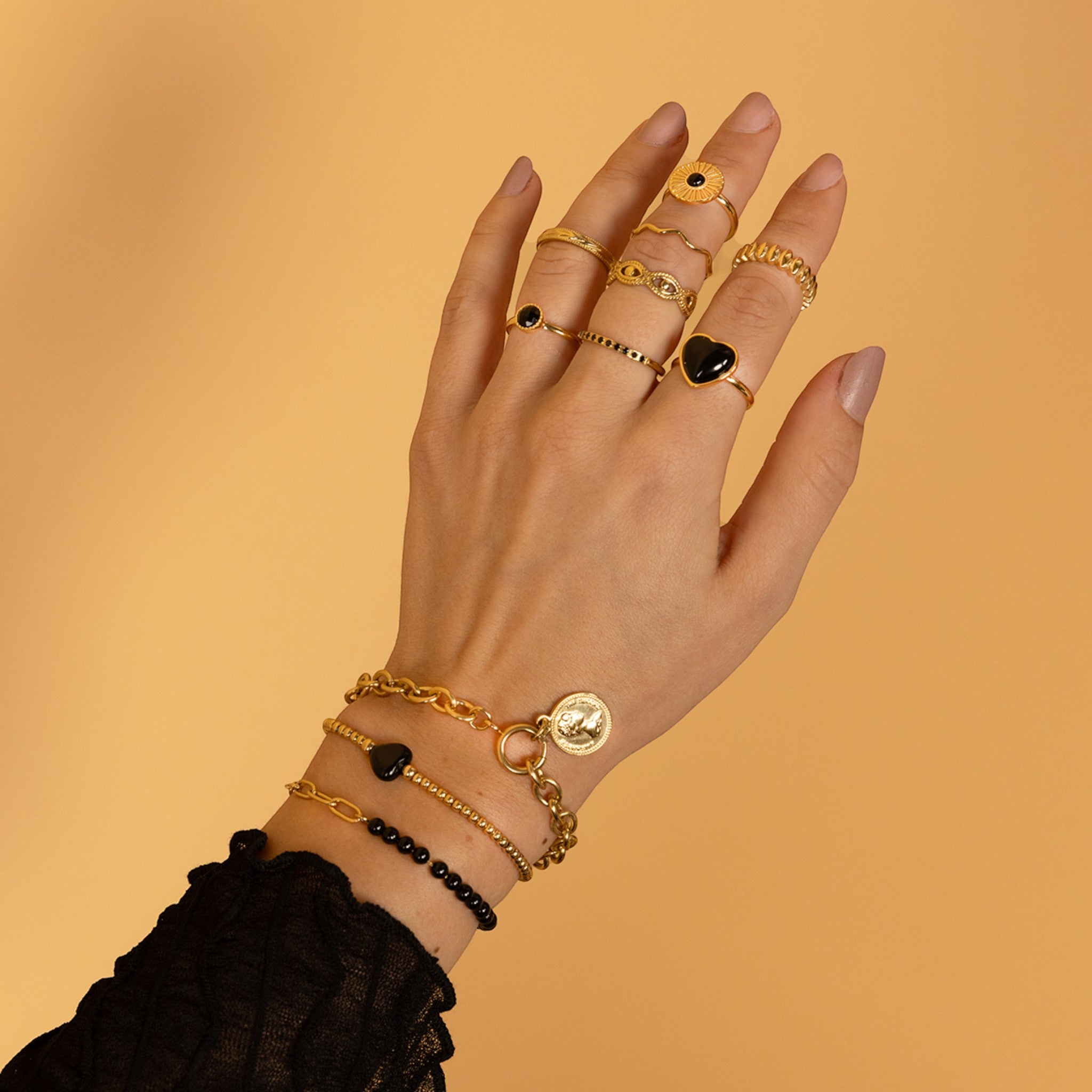 Gouden schakelarmband met Onyx edelstenen