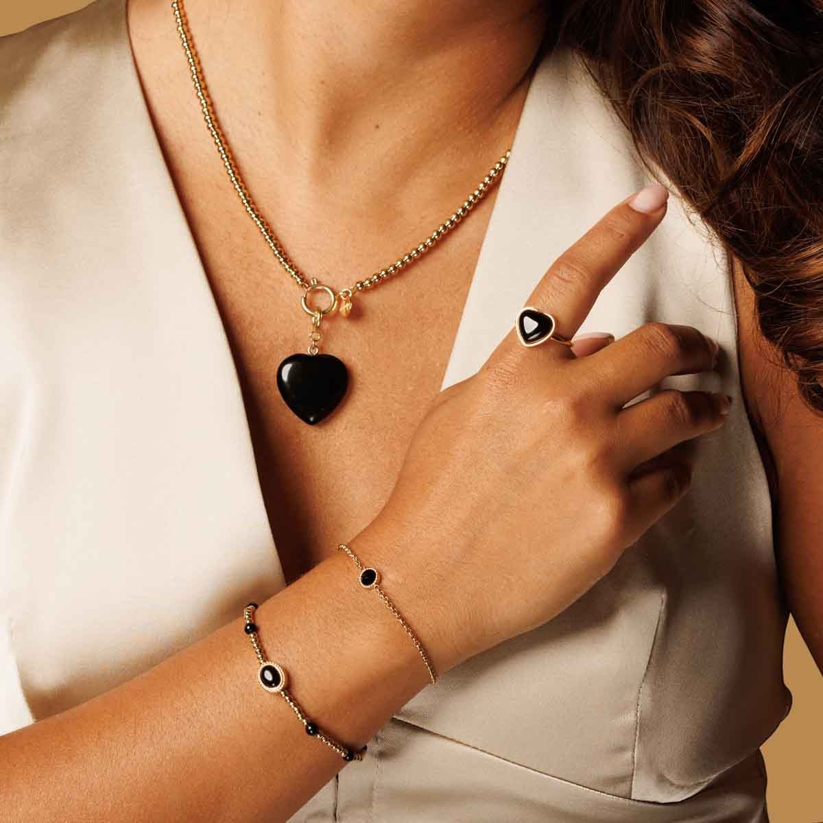 Gouden armband met een ovale Onyx edelsteen