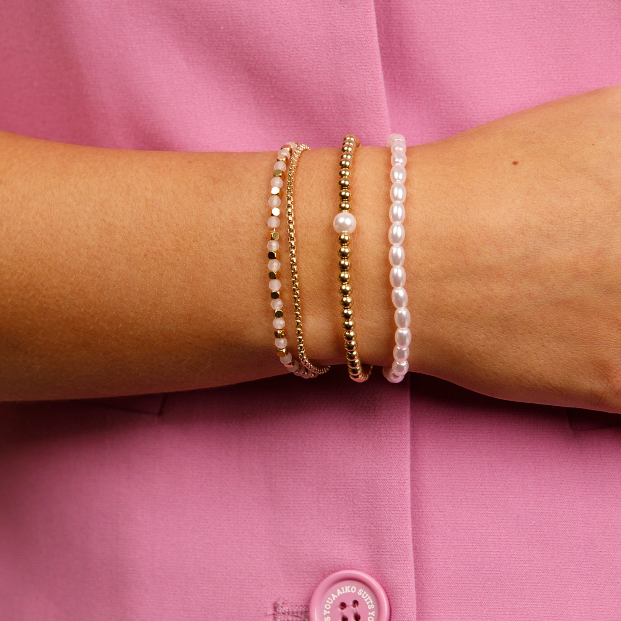 Gouden dubbele armband met roze glaskristallen